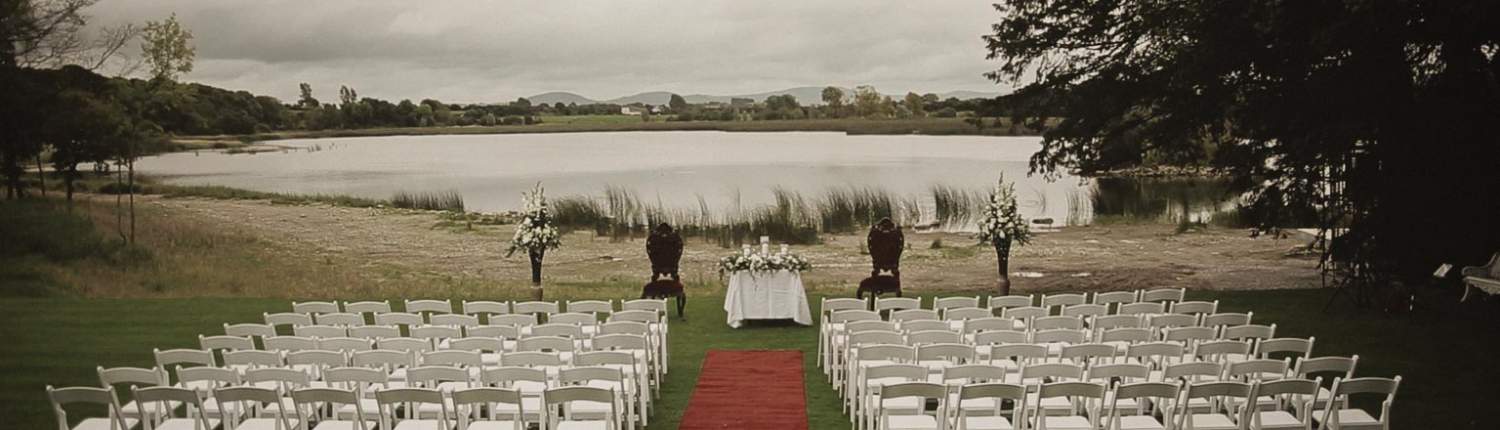 Wedding chair before ceremony in Ashley Park wit view at the lake